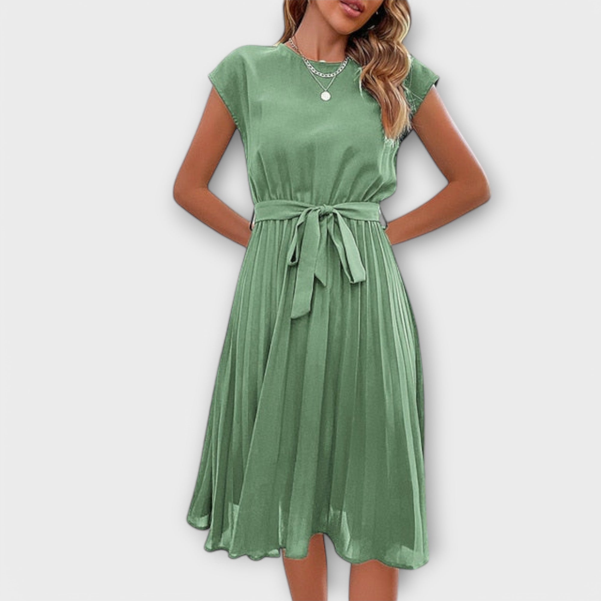 Detailed look at the Shira Summer Midi Pleated Dress's pleating and texture.