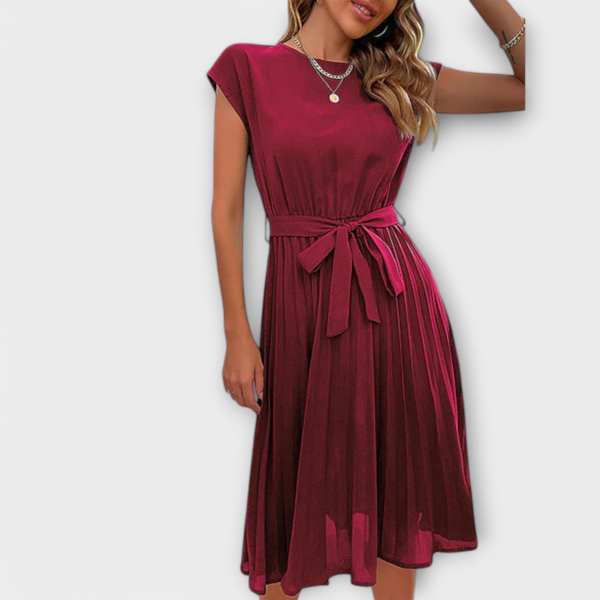 Back view of the Shira Summer Midi Pleated Dress's elegant design.