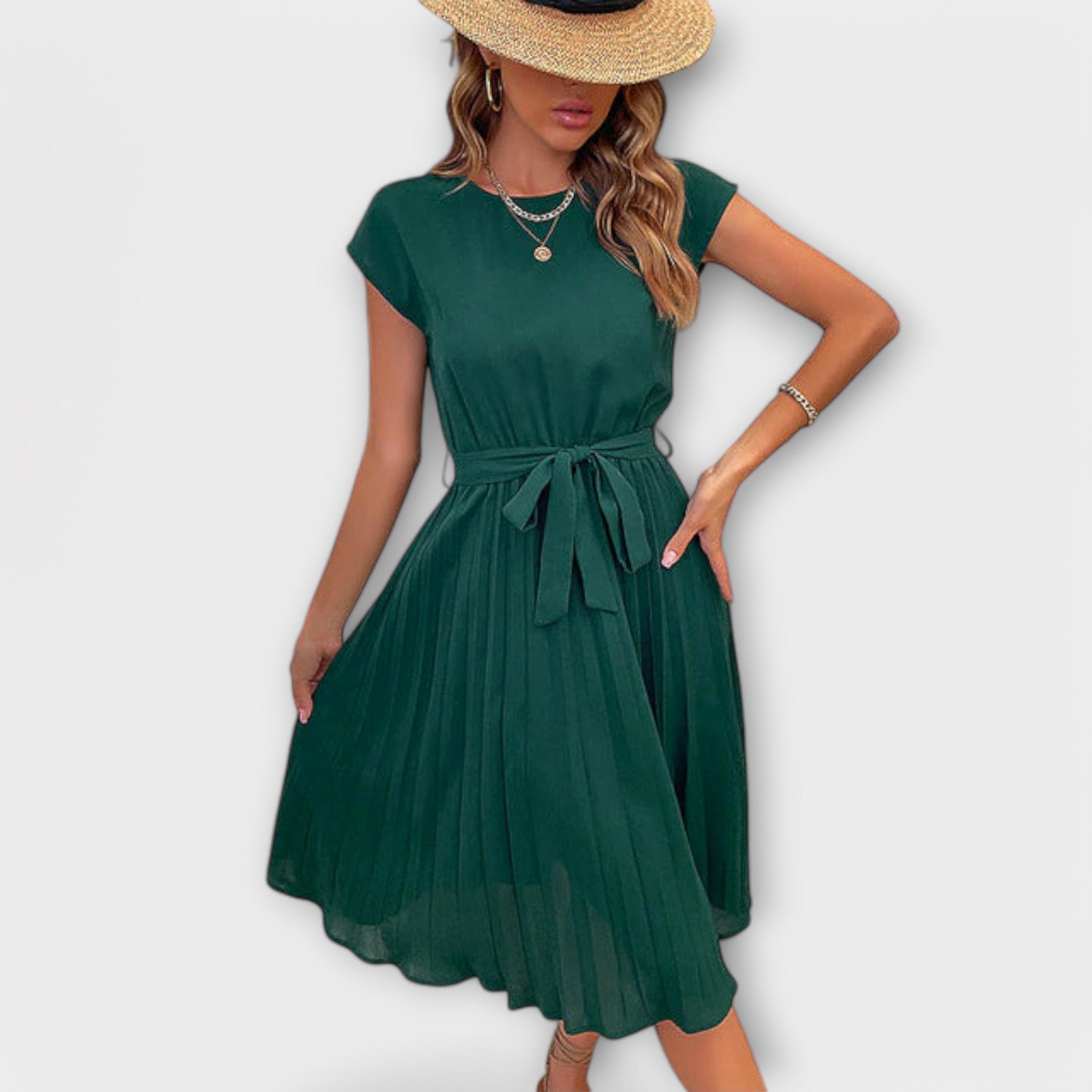 Close-up of the Shira Summer Midi Pleated Dress's pleated details.